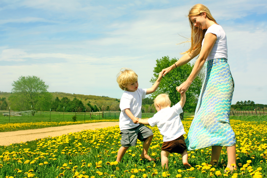 A mum and her two children get active and play in the sun.