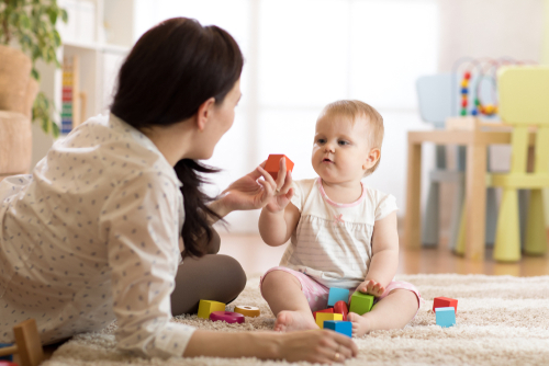 mother playing with blocks with her son